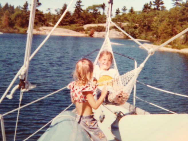 Kathy in the hammock and our cousin Robin on the canoe, soaking up sunshine.