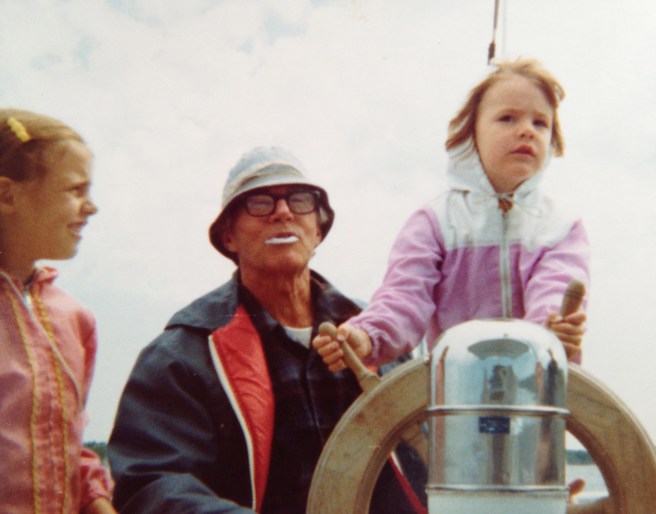 My sister Kathy, Grandpa, and me at the helm circa 1976.